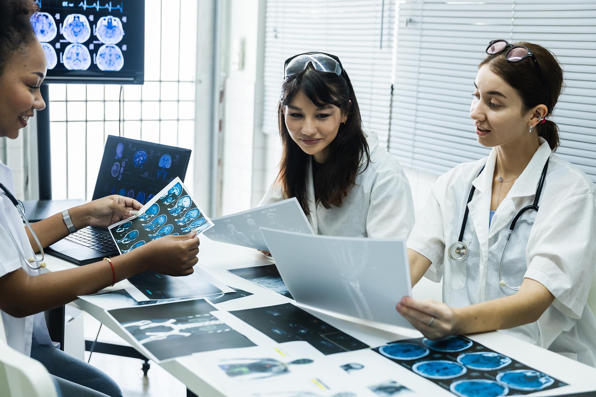 A group of doctors looking over x-ray results